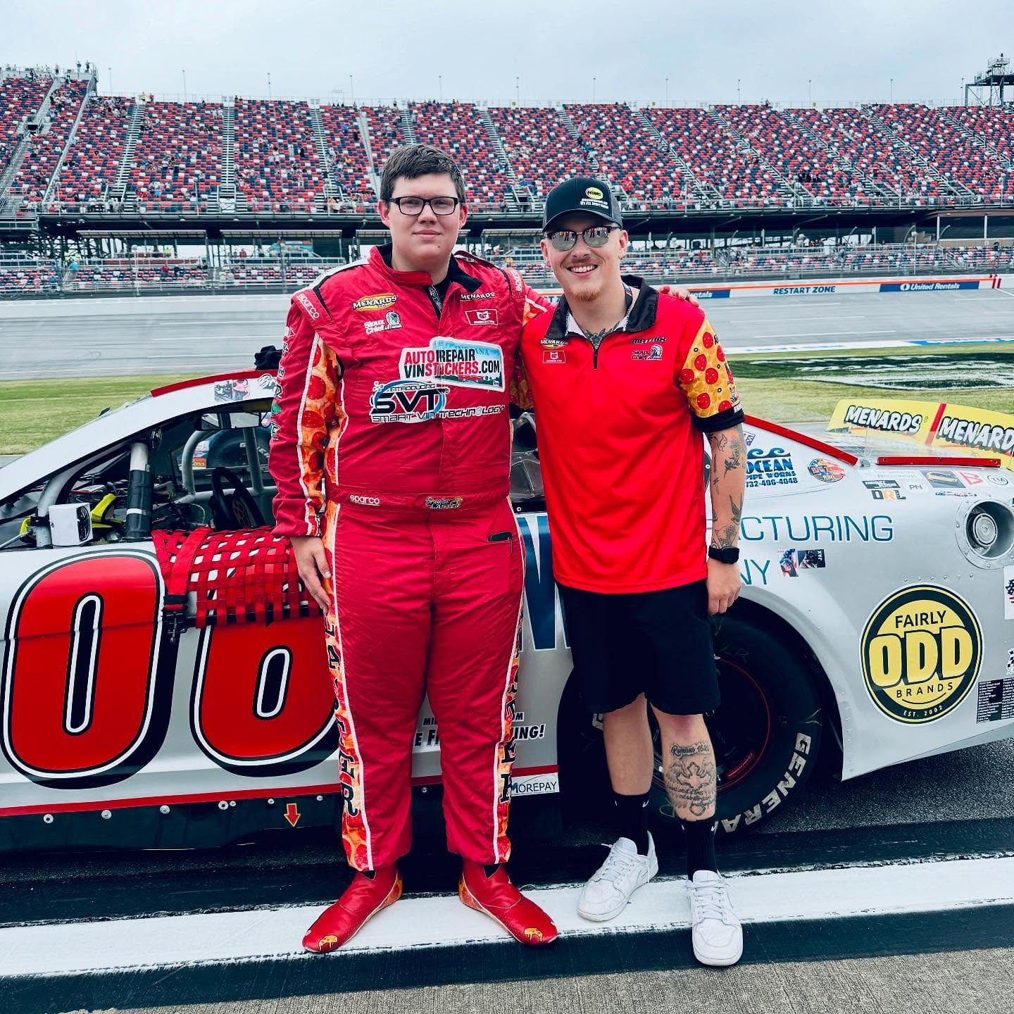 Joe R. Wells with Brayton Laster beside the No. 06 on the grid