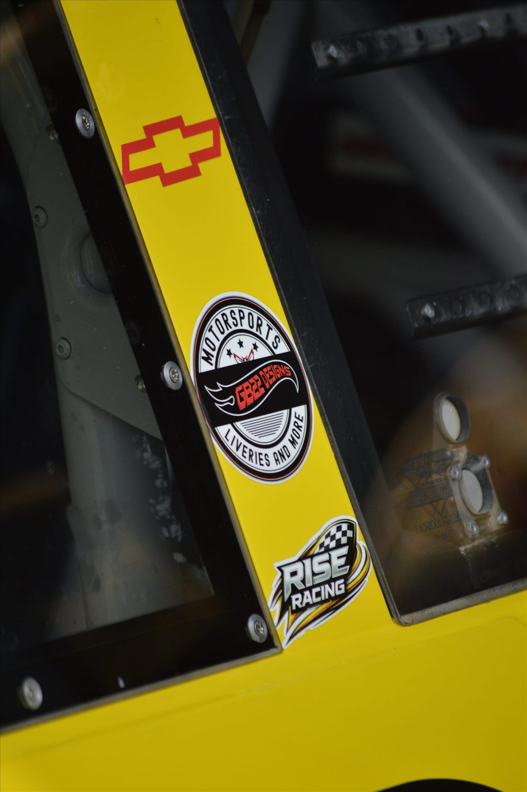 GB22 Designs decal on the yellow No. 89, above a Rise Racing decal