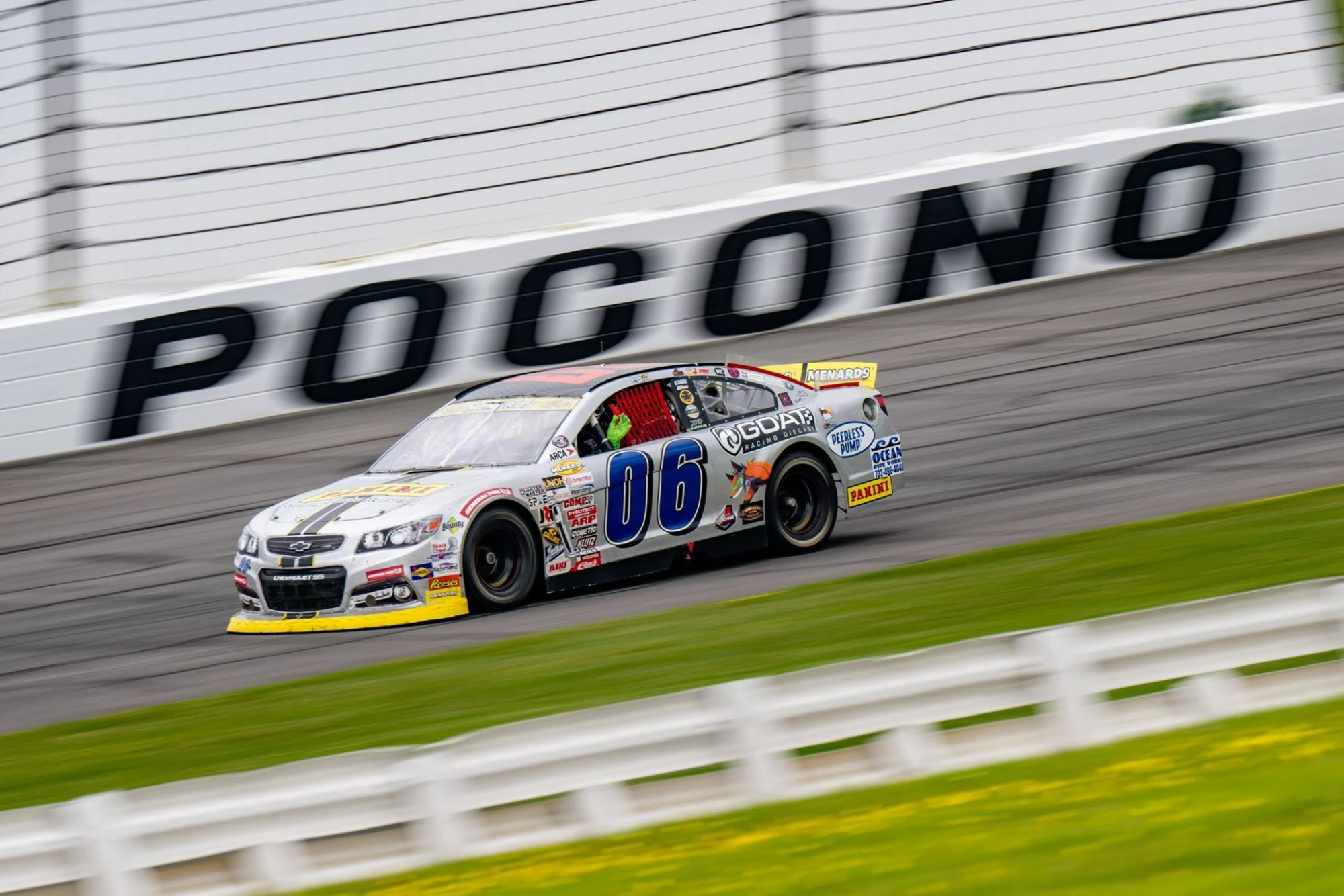 Silver No. 06 Panini Chevrolet passing the Pocono wall